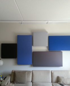 GIK Acoustics 242 Acoustic Panels in different colors and shapes above a couch