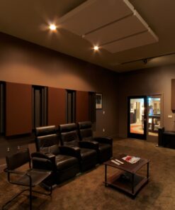 Listening room with large speakers, acoustic panels, and a colorful tapestry on the wall.