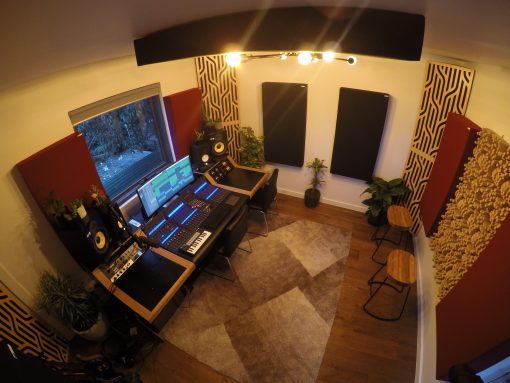 Home Studio with Impression Pro Series corner Bass Traps in Braids pattern in blonde veneer stacked in corners and gotham diffusors on back wall